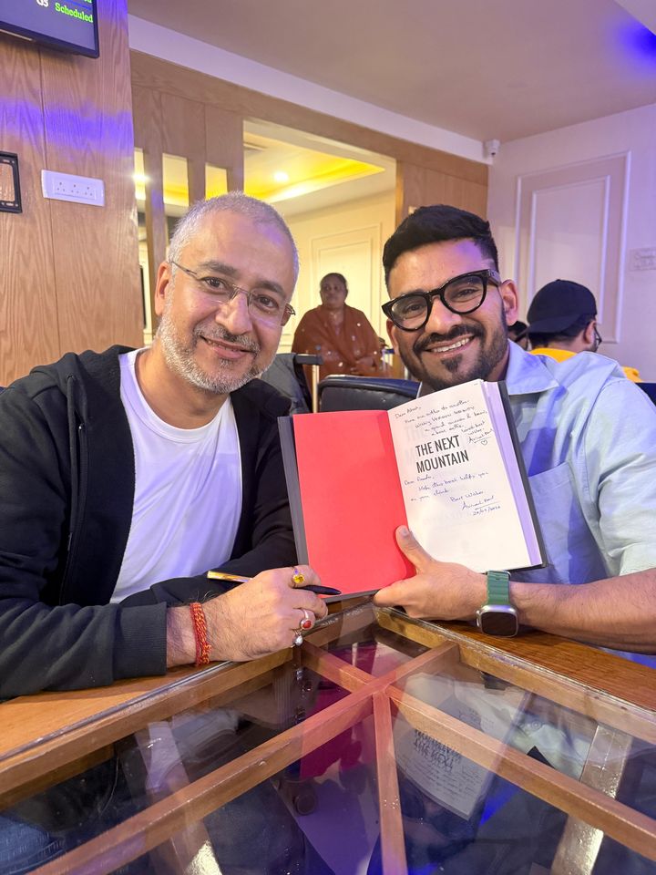 Avinash Kaul signing The Next Mountain for Akash Gupta, co-founder and CEO of Zypp Electric